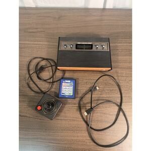 atari 2600 console with joystick, cables and one cartridge with 10 game working‎